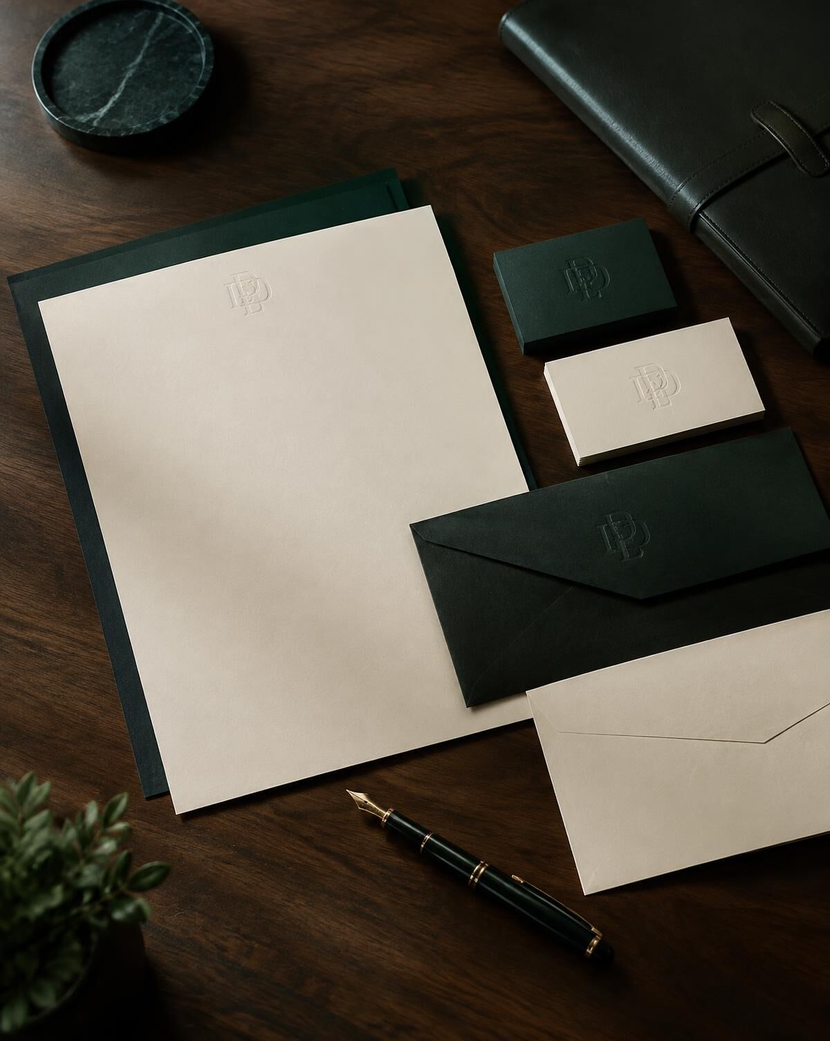 Concept stationery set in deep green and ivory with embossed monogram and fountain pen
